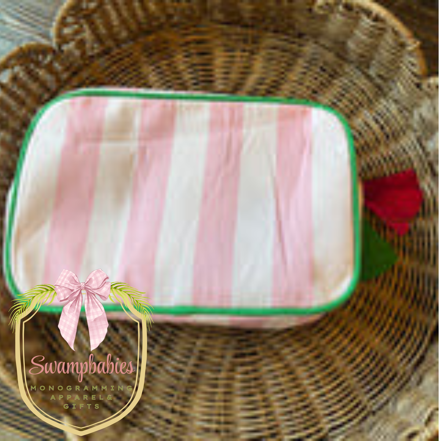Pink and white striped pouch with a green border 